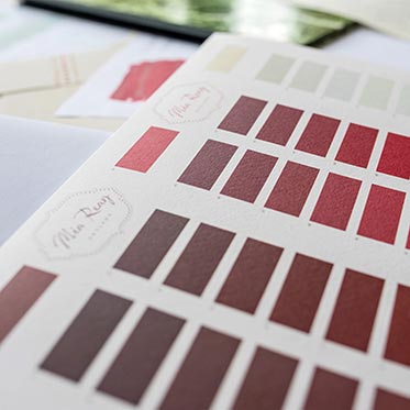 Colour swatches of red and browns